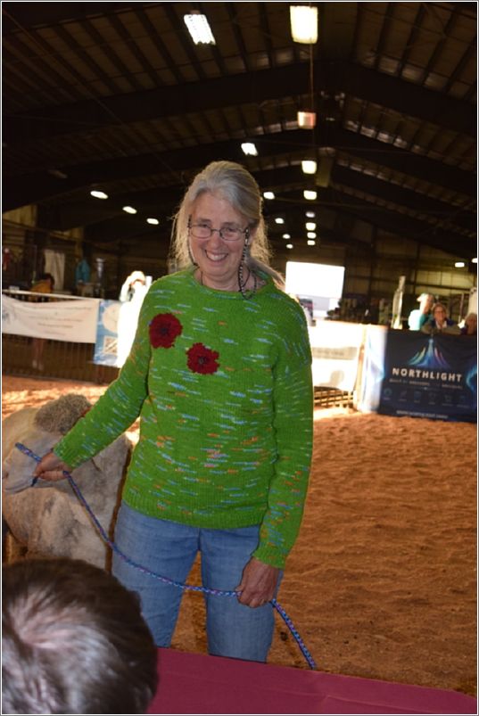 Daphne Stone wears her hand-knitted poppy sweater made using intarsia. Photo: Peggy Lundquist.